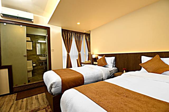 Deluxe Twin Room at The Milestone Hotel