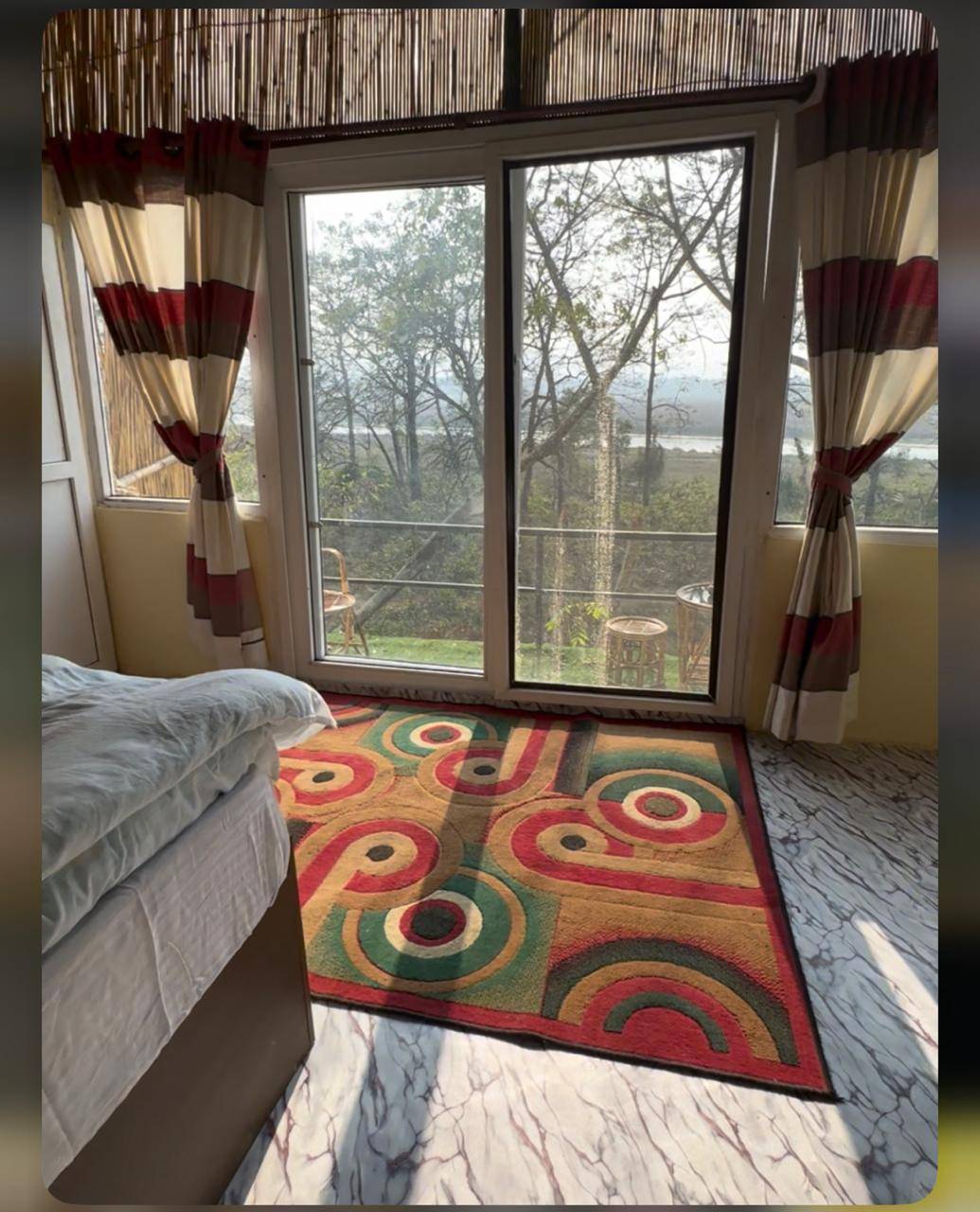 Enjoy Jungle River view and Deers from your bed. — photo
