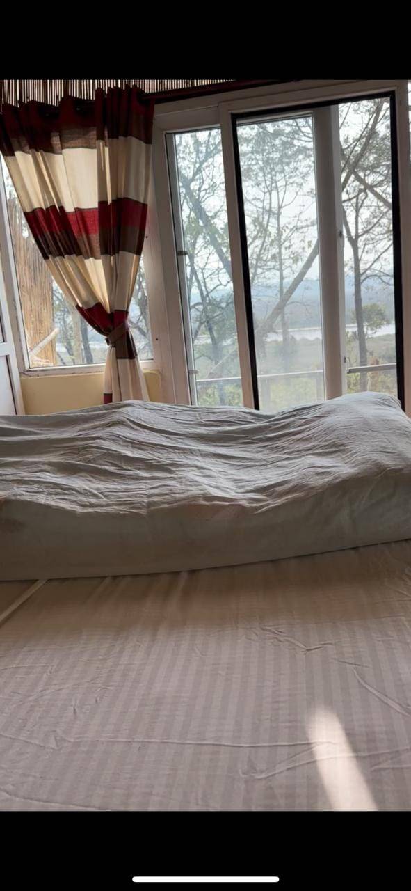 Enjoy Jungle River view and Deers from your bed. — photo